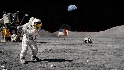 a man play golf on the moon