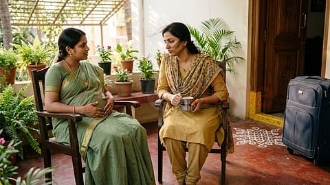 2 Women sitting in the chair and drink coffee