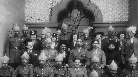 Maj Akbar Khan, bareheaded, in the centre and in uniform, and other Indian soldiers.