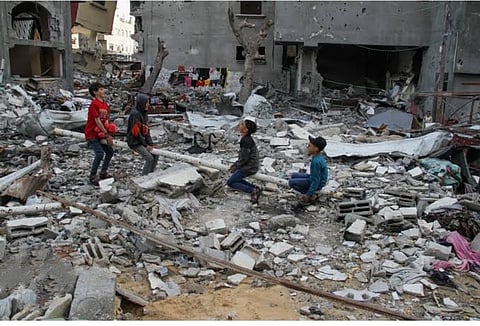 Children playing amid rubble of destroyed infrastructure of their schools in Gaza.