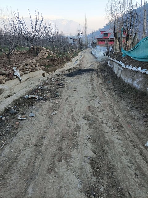 The central point of Peer Baba Mohalla, where the road lies in a state of severe disrepair, highlighting the urgent need for its completion in Bandipora.