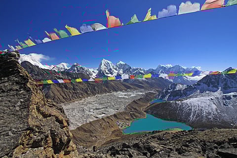 A glacier is a huge mass of ice that moves slowly over land. Glaciers are disappearing due to global warming.