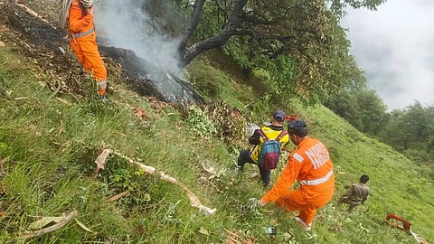 This photo shared by Uttarakhand Police on the X platform shows rescuers working at the site of a helicopter crash near Kedarnath, in Uttarakhand, India, Sunday, June 15, 2025.