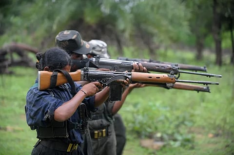 Indian Maoists ready their weapons as they take part in a training camp in a forested area of Bijapur District in the central Indian state of Chhattisgarh on July 8, 2012.