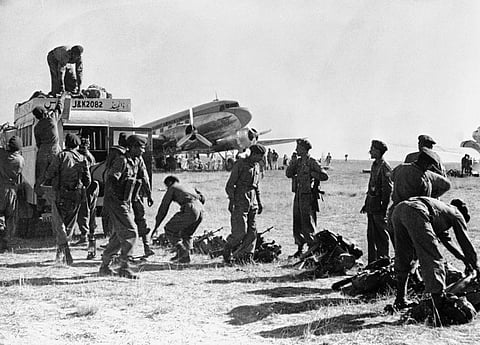 Indian soldiers landing at Srinagar airfield during the 1947–1948 war.
