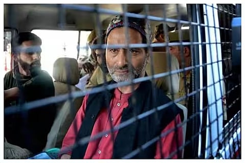 JKLF chairman Yasin Malik being taken to a court by police.