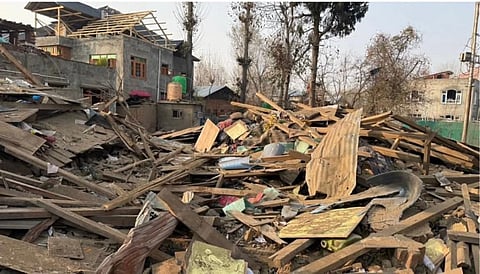 The rubble of the house demolished in a controlled explosion by security forces in village Koil in Pulwama belonging to the family of Dr Umar un Nabi, one of the suspects in Delhi Red Fort explosion case.