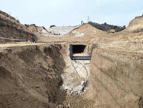 Tunnel construction for four-lane Ring Road is ongoing, with heavy machinery cutting through the hills covered with evergreen forest trees in village Kheri near Jammu, winter capital of Jammu and Kashmir.