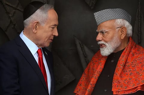 Indian Prime Minister Narendra Modi, right speaks with his Israeli counterpart, Benjamin Netanyahu, after paying respects before the eternal flame at the Hall of Remembrance during his visit to the Yad Vashem Holocaust Memorial Museum in Jerusalem on February 26, 2026