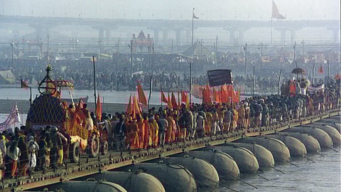 Hindu Pilgrims go over the Ganga river in the 2001 Kumbh-Mela.
