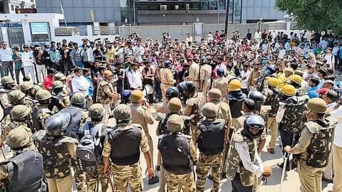Workers protest on April 14, 2026, in Noida, the main industrial centre in India's largest state of Uttar Pradesh.