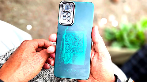 A pony handler in Pahalgam, a tourist resort in Anantnag district, South Kashmir, carries a QR code stuck to the back of his phone, an identity tag meant to mark him as a verified and authorised worker.