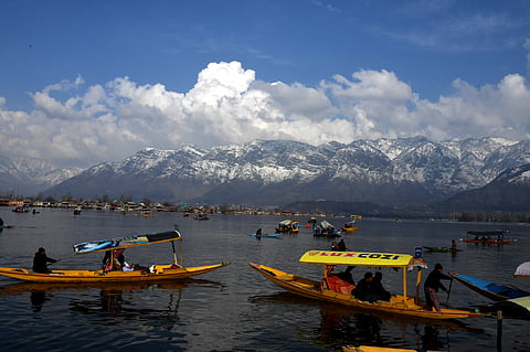 A view of Dal Lake with snow-capped Zabarwan mountain range in Srinagar, Jammu and Kashmir on a sunny Friday, February 23, 2024. KT Photos/Qazi Irshad 

