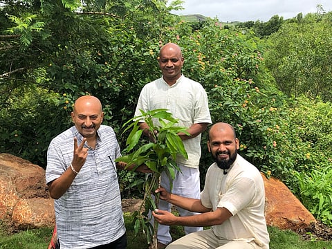 Peace activists Nitin Sonawane, Jalandharnath Channole and Yogesh VishwaMitra with the Chausa sapling gifted by a Pakistani farmer.
