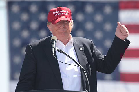Donald Trump wearing a Make America Great Again cap during his 2016 presidential campaign. 
