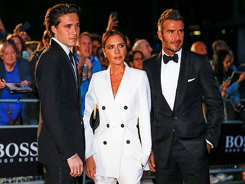 بروكلين بيكهام مع ديفيد وفيكتوريا بيكهام