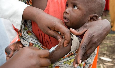 An affected child receiving a vaccine 