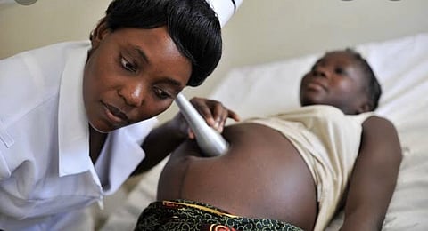 Pregnant teenage girl receiving antenatal care