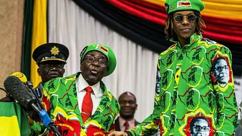 Robert Mugabe (L) with his son (R)