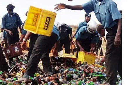 Bottles of alcohol being destroyed