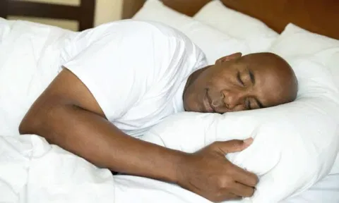 Man in bed sleeping