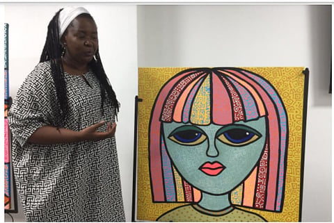 Ms Ella Onyebe in Abuja, during the solo art exhibition 