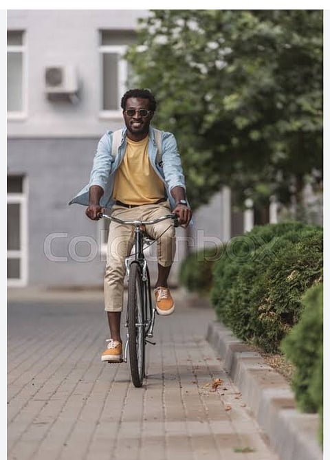 Photo of man riding a bicycle 