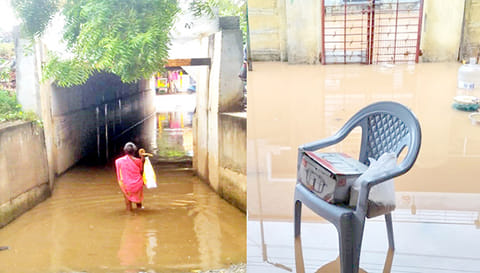 ரெயில்வே கீழ்பாலத்தில் தண்ணீர் தேங்கி நிற்பதையும், வீட்டுக்குள் மழைநீர் சூழ்ந்திருப்பதை காணலாம்.