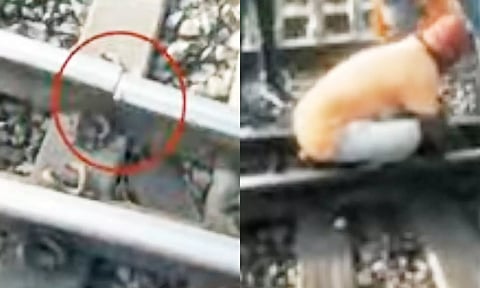 தண்டவாளத்தில் ஏற்பட்ட விரிசலை ரெயில்வே ஊழியர்கள் சரிசெய்த காட்சி