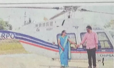 மணமக்கள் ஹெலிகாப்டரில் செல்ல காத்திருந்த காட்சி.