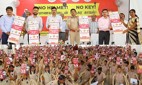 நிகழ்ச்சியில் சாலை பாதுகாப்பு விழிப்புணா்வு குறித்த குறும்படம் மற்றும் சுவரொட்டிகளை கலெக்டர் வினீத் வெளியிட்ட காட்சி. அருகில் அதிகாரிகள் உள்ளனர்.&nbsp;