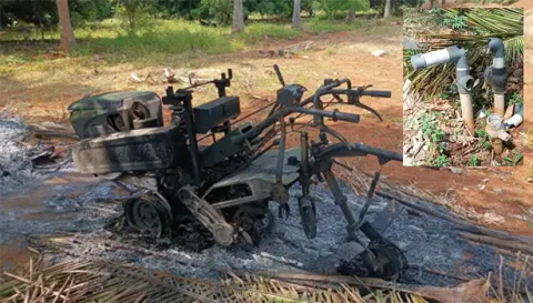 விவசாய தோட்டத்தில் நிறுத்தி வைக்கப்பட்டிருந்த பவர் டில்லர் எரிந்து நாசமாகி இருப்பதை படத்தில் காணலாம்.