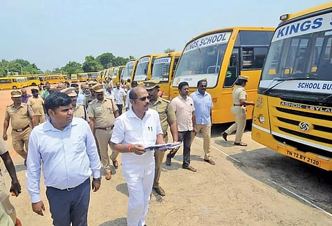பள்ளி வாகனங்களை கலெக்டர் கார்த்திகேயன் ஆய்வு செய்த காட்சி. அருகில் ஆர்.டி.ஓ. சந்திரசேகர்.&nbsp;