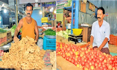 பாளை மார்க்கெட்டில் விற்பனைக்காக குவித்து வைக்கப்பட்டுள்ள இஞ்சி, தக்காளி.
