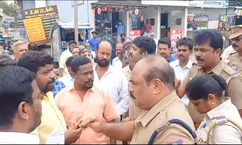 போலீசாருடன் வாக்குவாதத்தில் ஈடுபட்ட பா.ஜ.க.வினரை படத்தில் காணாலம்.