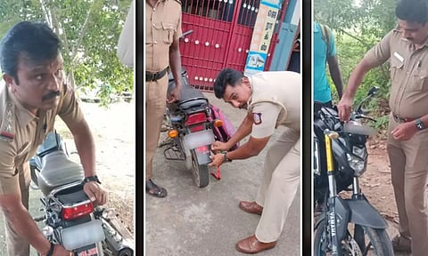 இருசக்கர வாகனங்களில் ஒட்டப்பட்டிருந்த போலீஸ் ஸ்டிக்கர்களை போலீசார் அகற்றிய காட்சி.