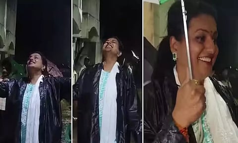 புயல் மழையில் குடையுடன் மந்திரி ரோஜா நடனமாடிய காட்சி.
