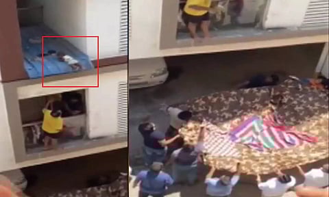 அடுக்குமாடி குடியிருப்பு பால்கனியில் தொங்கிய கைக்குழந்தை - பதறிய குடியிருப்புவாசிகள்