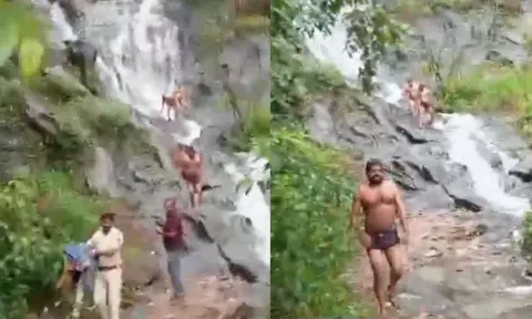 தடையை மீறி அருவியில் குளித்தவர்களின் ஆடைகளை எடுத்துவந்த போலீசார் - வீடியோ