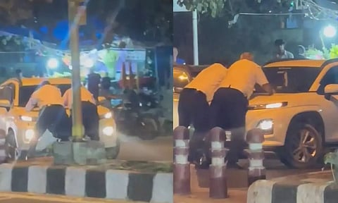 நாங்க ரொம்ப ஸ்டிரிக்ட்.. நிறுத்தாமல் சென்ற கார் மீது தொங்கியபடி பயணித்த டிராபிக் போலீஸ் - வீடியோ