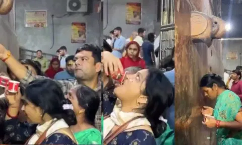 கோவில் ஏசி மெஷின் குழாயில் வந்த நீரை தீர்த்தம் என்று வரிசைகட்டி பிடித்துக் குடித்த பக்தர்கள் - வீடியோ