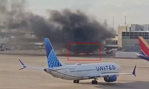 தீப்பிடித்து எரிந்த அமெரிக்கன் ஏர்லைன்ஸ் விமானத்தால் பரபப்பு