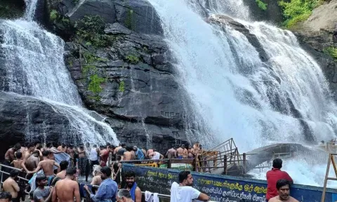 மழை குறைந்து நீர்வரத்து சீரானது- குற்றால அருவிகளில் குளிக்க அனுமதி