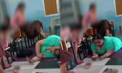 VIDEO: குப்புறப் படுத்து மொபைல் பார்க்கும் தலைமை ஆசிரியை - மசாஜ் செய்துவிடும் மாணவிகள் | #Uttarpradesh