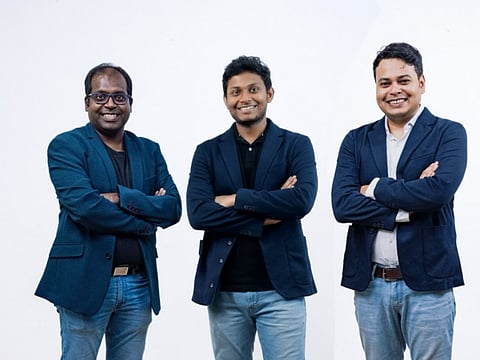 A professional photo of three men, the founders and leadership of DrinkPrime, standing side-by-side with arms crossed against a plain white background.