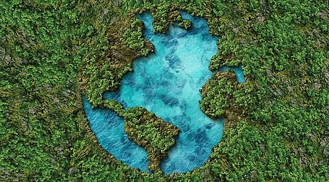 Digital conceptual art of the Earth's continents formed by lush green forests and deep blue water bodies, representing global water security and ecological balance.