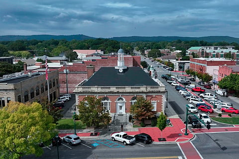 Historic downtown charm framed by rolling hills and moody skies