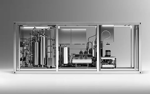 Modular decentralised water microfactory producing treated drinking water near the point of consumption.