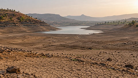 Drought-affected farmland and low water storage in Maharashtra.