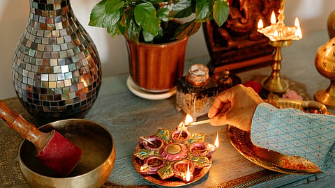 A beautiful Diwali décor, comprising diyas, succulent plant, flower vase and more. 